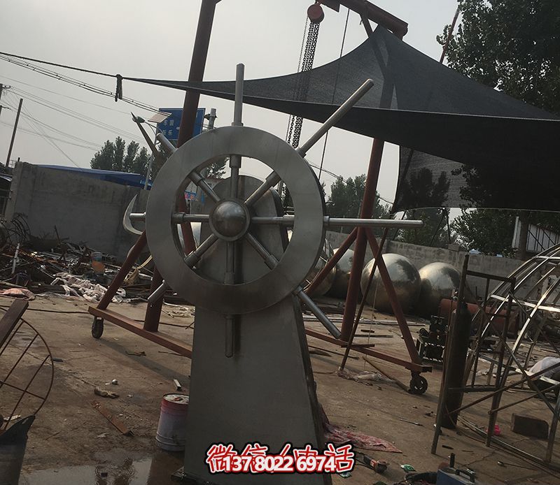 騰飛不銹鋼雕塑船舵，點綴室內(nèi)飯店