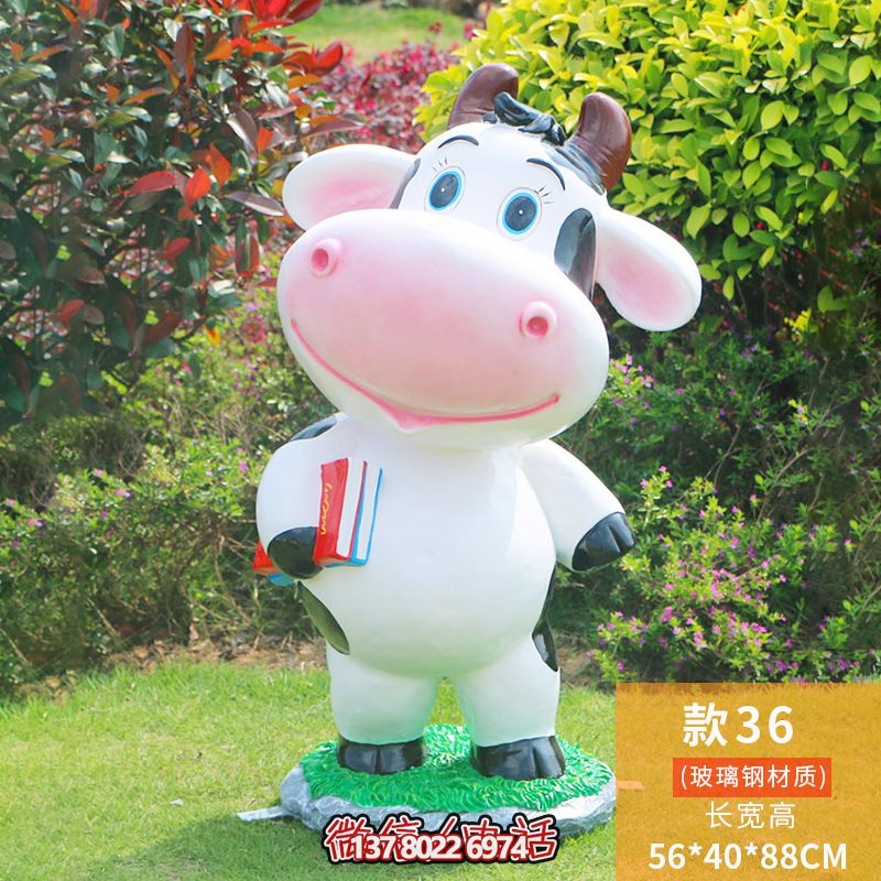 圖書(shū)館一只拿書(shū)的玻璃鋼牛雕塑